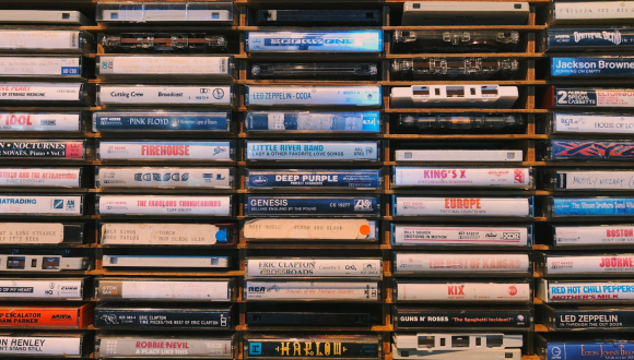 A shelf full of old random VHS tapes